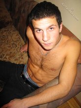 Cool dude takes off his black sleeveless t-shirt