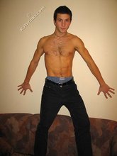 Cool dude takes off his black sleeveless t-shirt