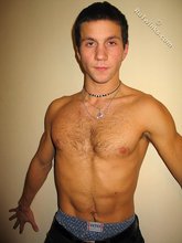 Cool dude takes off his black sleeveless t-shirt