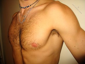 Cool dude takes off his black sleeveless t-shirt