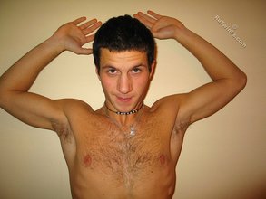 Cool dude takes off his black sleeveless t-shirt