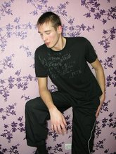 Dark-haired twinks passionately making out by the wall