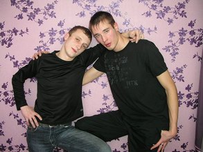 Dark-haired twinks passionately making out by the wall