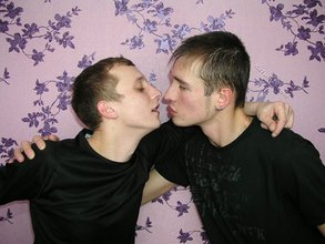 Dark-haired twinks passionately making out by the wall