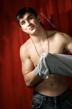 SIx pack stud putting his sexy clothes back on