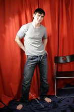 SIx pack stud putting his sexy clothes back on