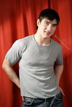 SIx pack stud putting his sexy clothes back on