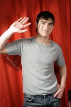 SIx pack stud putting his sexy clothes back on