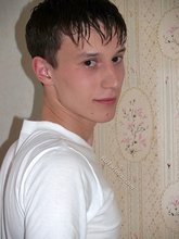 Teen guy showing off his asshole next to a window