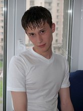 Teen guy showing off his asshole next to a window