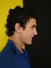 Curly-haired twink seducing with his six-pack