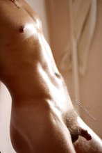 Hairy cock hottie showing off by the white wall