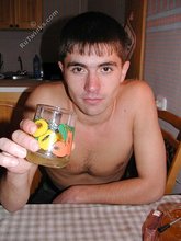 Playful twink drinking tea and showing his hairy ass