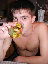 Playful twink drinking tea and showing his hairy ass