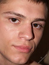 Serious-looking twink boy showing his meaty cock to you