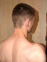 Serious-looking twink boy showing his meaty cock to you