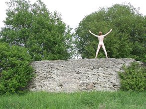 Redheaded twink posing completely naked outdoors