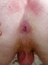 Redheaded twink posing completely naked outdoors