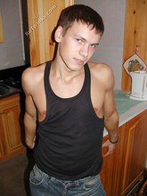 Wife-beater wearing twink boy shows off his impressive body
