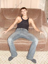 Wife-beater wearing twink boy shows off his impressive body