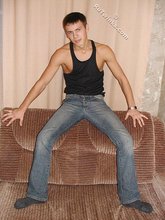 Wife-beater wearing twink boy shows off his impressive body