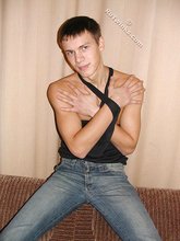 Wife-beater wearing twink boy shows off his impressive body