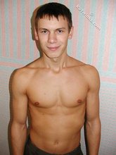 Wife-beater wearing twink boy shows off his impressive body