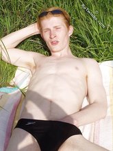 Redheaded twink exposes his creamy ass outdoors