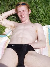 Redheaded twink exposes his creamy ass outdoors
