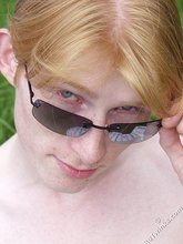 Redheaded twink exposes his creamy ass outdoors