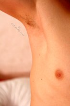 Blond-haired barely legal boy shows his pits and cock