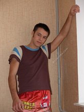 Colorfully dressed twink shows off that tight ass