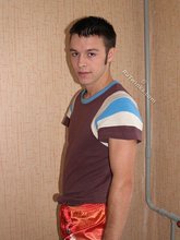 Colorfully dressed twink shows off that tight ass