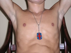Twink boy showing his sexy cock while posing on a chair