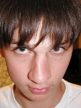 Pretty-looking twink making funny faces at the camera