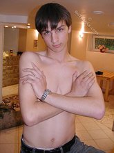 Dark-haired dude teasing his own junk on camera
