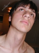 Dark-haired dude teasing his own junk on camera