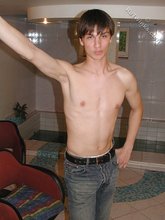 Dark-haired dude teasing his own junk on camera