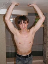 Dark-haired dude teasing his own junk on camera