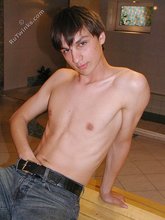 Dark-haired dude teasing his own junk on camera