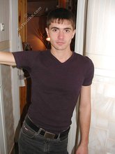 Dark-haired twink posing shirtless on camera