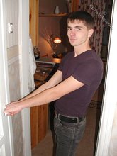 Dark-haired twink posing shirtless on camera