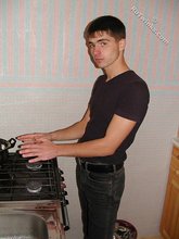 Dark-haired twink posing shirtless on camera