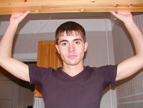 Dark-haired twink posing shirtless on camera