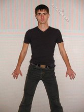 Dark-haired twink posing shirtless on camera