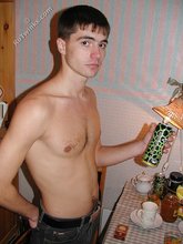 Dark-haired twink posing shirtless on camera