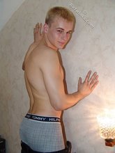 Blond-haired boy shows his bulge on camera