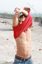 Red wife-beater twink shows off his six-pack outdoors