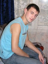 Blue shirt twink boy looks stoned out of his mind