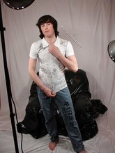 Long-haired twink puts his clothes back on